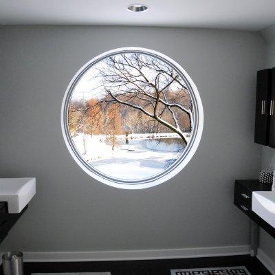 Main bathroom picture window view of pond and trees 